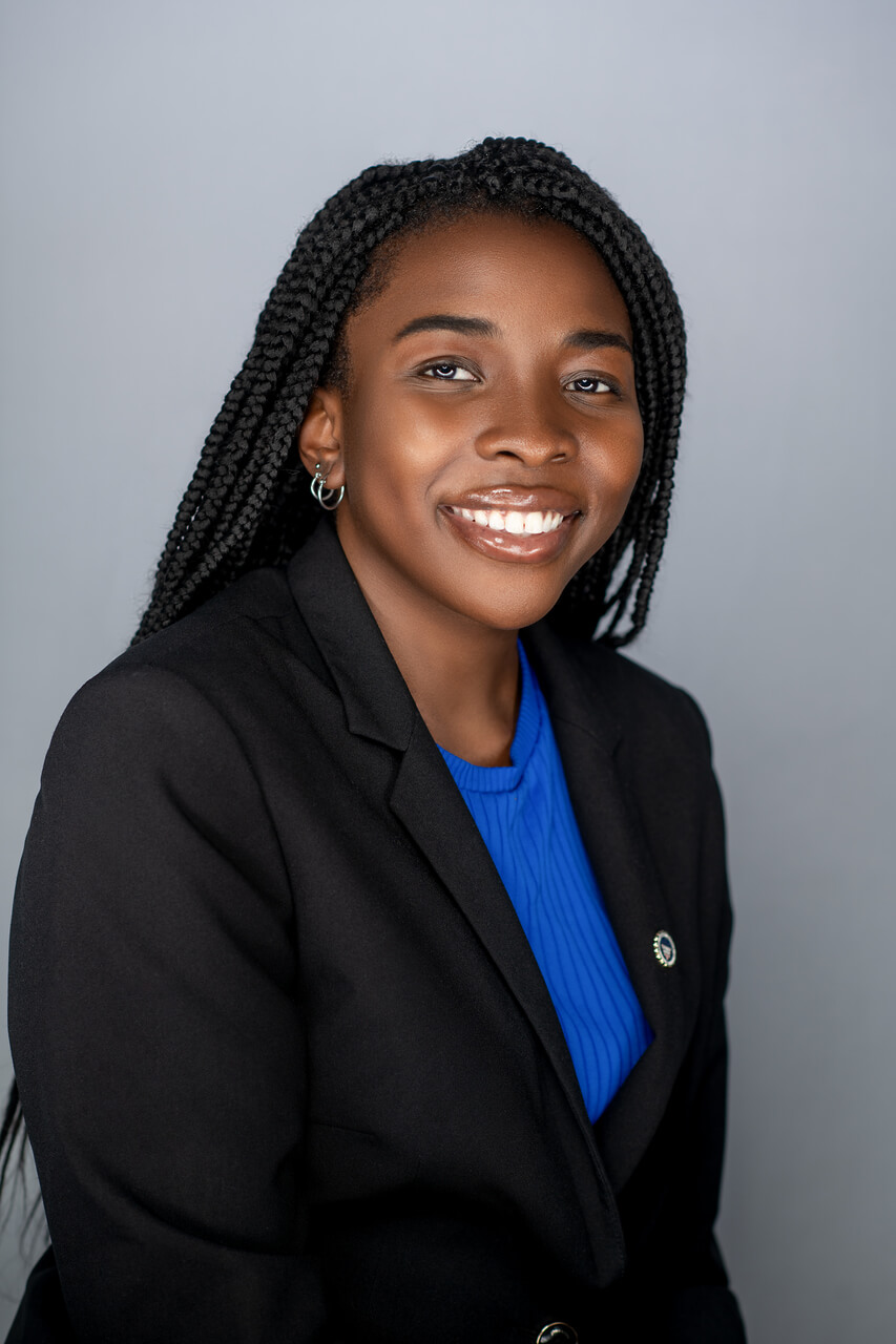 Fola Poses against Gray Background