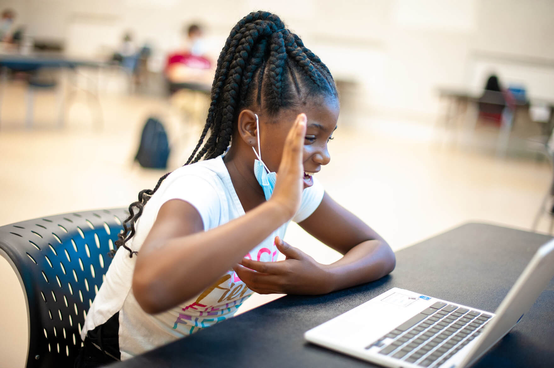 Photo of student talking to tutor via laptop