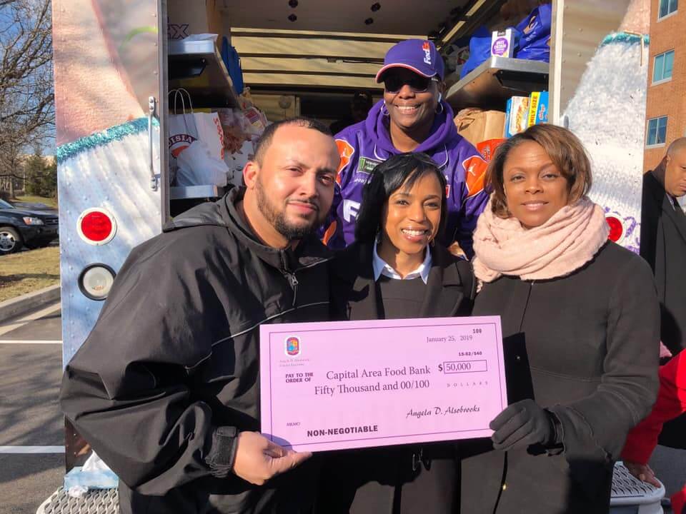 WHUR InterimGM Sean Plater_PG County Executive Angela Alsobrooks_ FedEx rep and WHUR reporter for Rolling Food Drive.jpeg