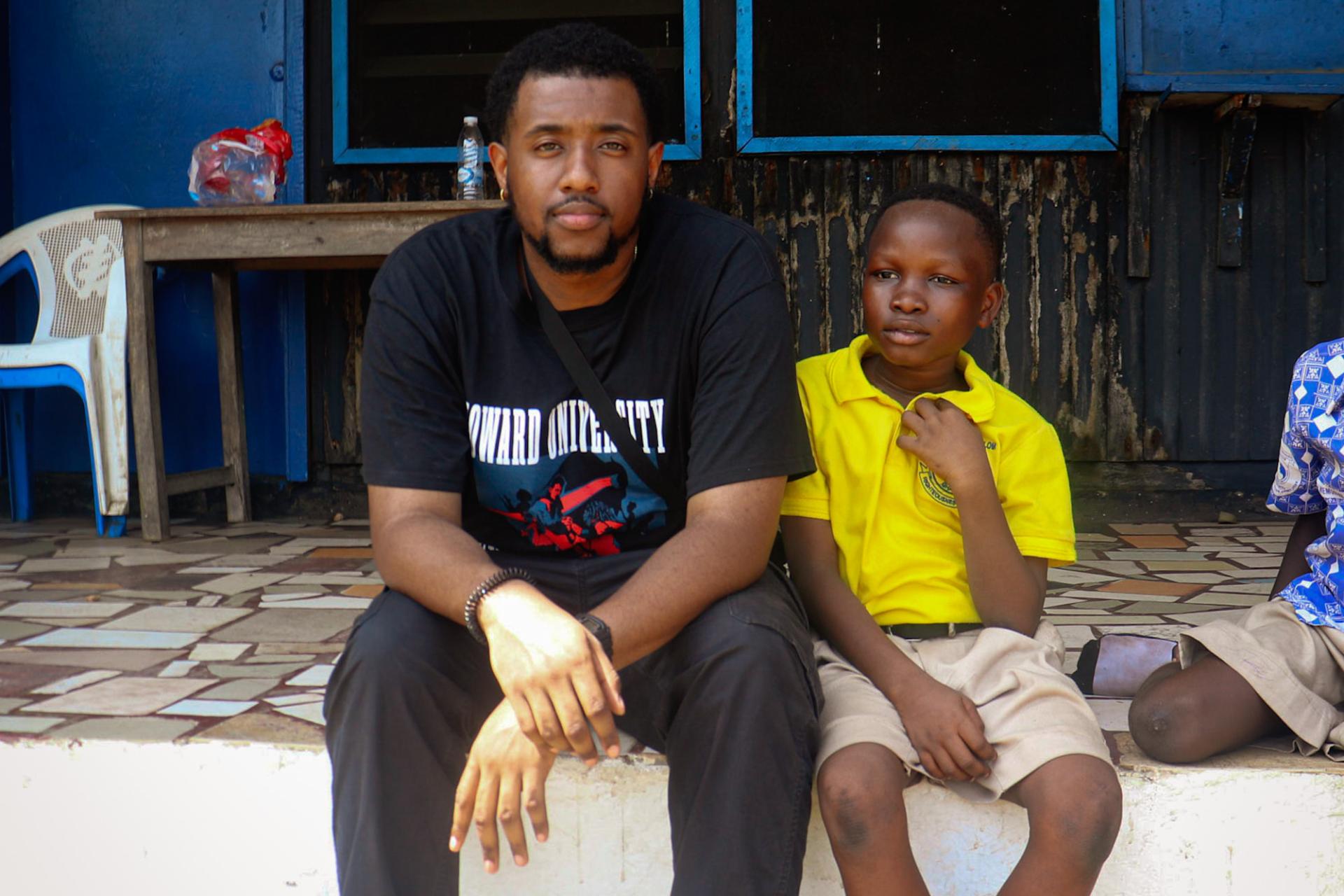  The Calebs: Howard University senior Caleb White posing with a Kwame Nkrumah Memorial School student whose name is also Caleb. 