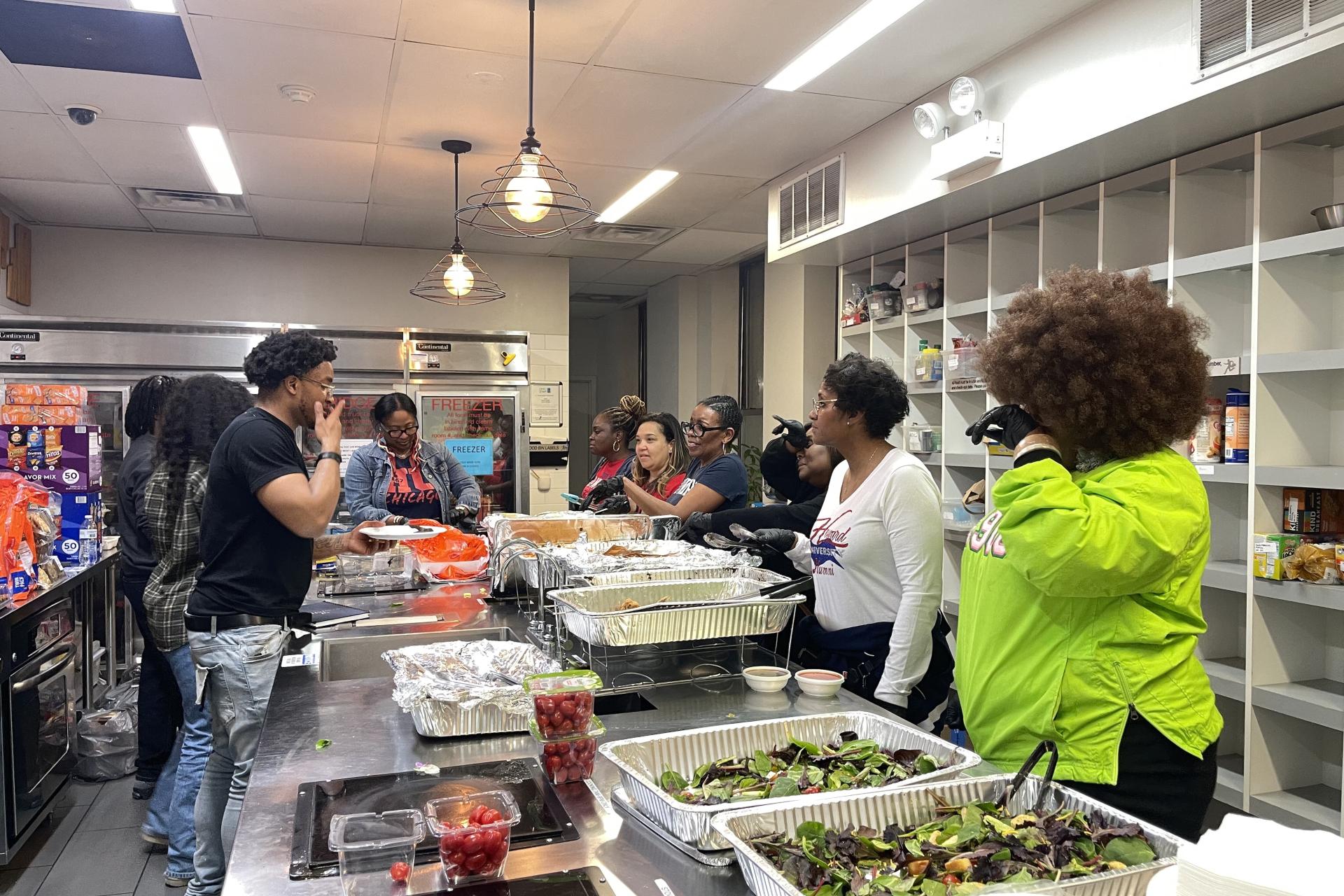 Members of the Howard Alumni Association of Chicago provide dinner to current Howard students. Autumn Coleman for The Dig 