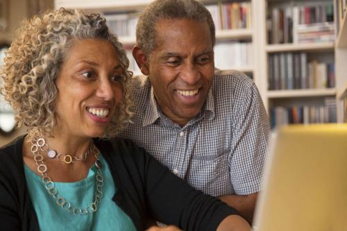 Older Couple Looking at a Computer