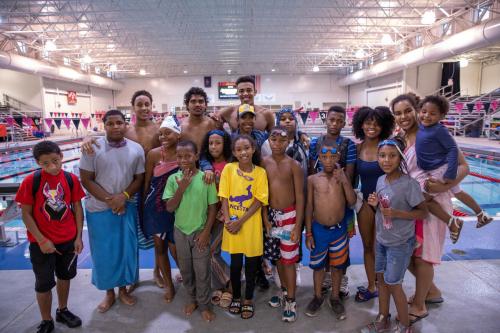 Swim Team with Young Students