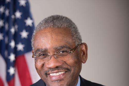 Gregory Meeks in front of american flag
