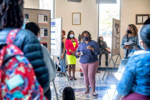 Brianna Clark Ph.D., discusses her research on "Women of HU Athletics: The Intersection of Gender & Race" at an exhibition hosted by the Center for Women, Gender and Global Leadership. -Justin D. Knight/Howard University