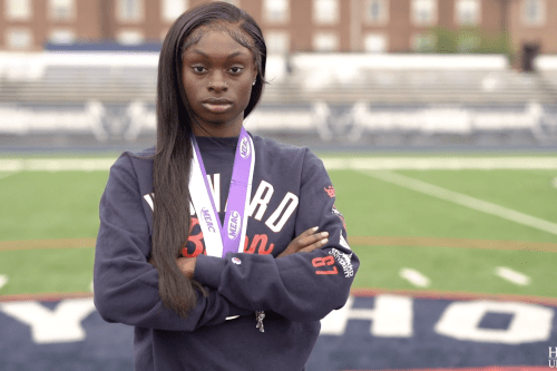 Graduating Howard University senior Jessica Gbai wearing track medals.