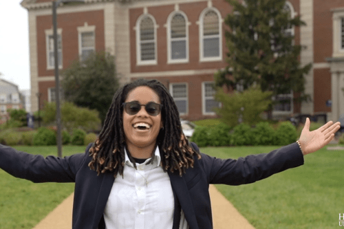 Graduating Howard University senior Syeara Dunlap outside Founders Library