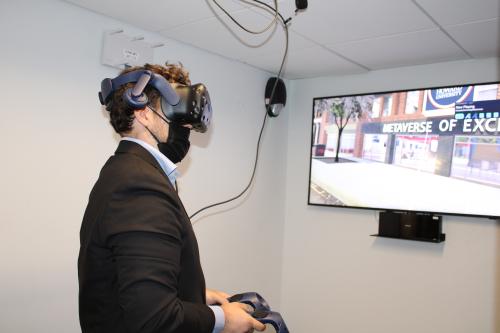 Man demonstrates virtual reality equipment at Howard University Centers of Excellence headquarters