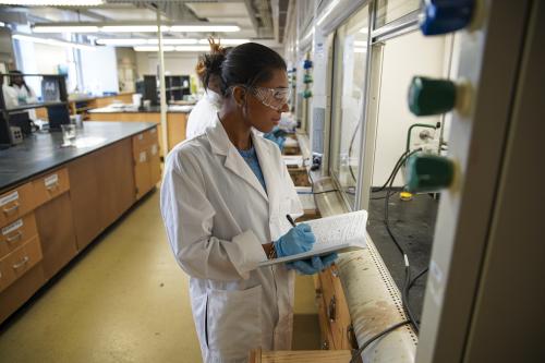 Sydney Kates, senior biology student conducts fractional distillation during a class experiment. -Chris Campbell/Howard University