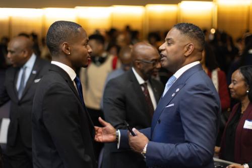 Calvin Butler speaks to a student