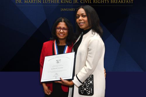 Dr. Chandran receiving award from Heart of Tabitha foundation 