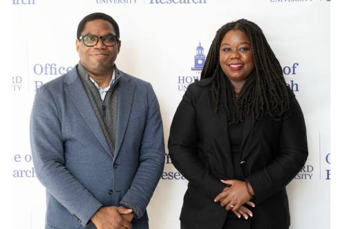 Dr. Andy and Dr. Clarke attending AI Symposium
