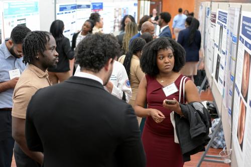 Students viewing presentations during Research Symposium