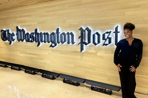 Zoe Cummings standing in front of the Washington Post sign