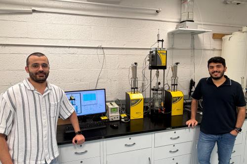 Jaradat at work in his Geomaterials Research Lab with Ph.D. student Mohammad Almasaeid