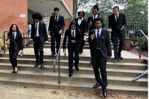 Students wearing black suits