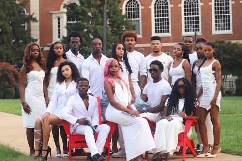 Models Inc. posed in The Yard wearing stylish white outfits