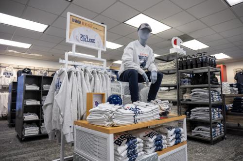 Merchandise at the Bison Exchange Campus Store with a mannequin wearing Howard University clothing
