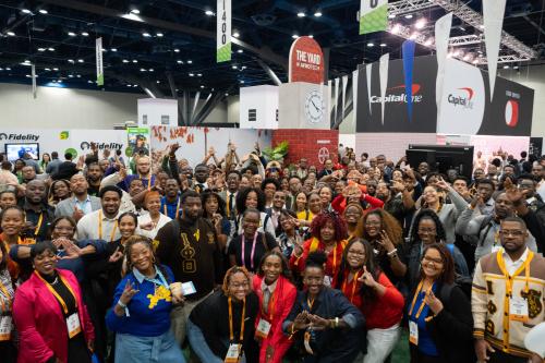 A group of Black technology professionals gather for a photo at The Yard at Afrotech activation in 2025