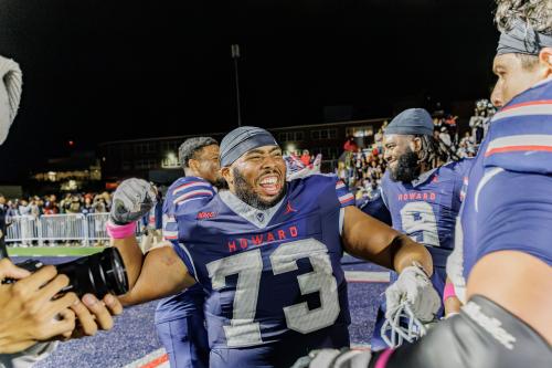 Howard University Bison players at a Bison game in uniforms