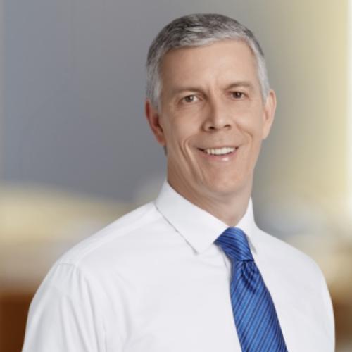 Arne Duncan with White Shirt and Blue Tie