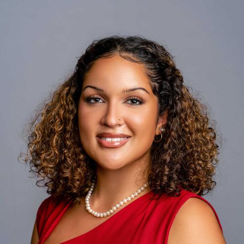 Madeline Bumpus wearing a red dress 