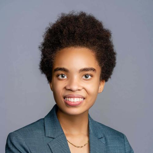 Aaliyah McAfee wearing a blue patterned blazer with a white shirt