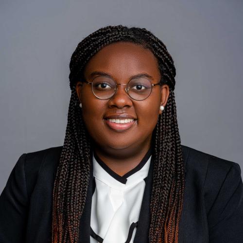 Jasmine Terrell wearing a black blazer with a white and black blouse