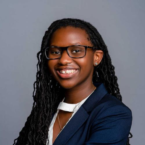 Kennedi White wearing a navy blue blazer with a white blouse