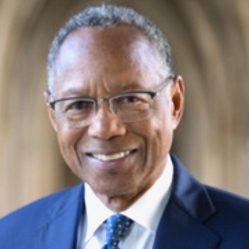 A. Eugene Washington Wearing a Blue Blazer White Shirt Blue Tie