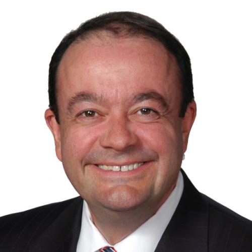 Ziad Ojakli Wearing a White Shirt with Muliti Red Tie