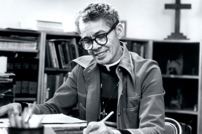 B/W photo of Pauli Murray writing at a desk
