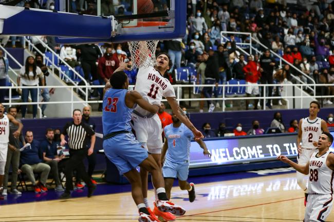 Senior guard Kyle Foster rises up for an emphatic bucket during a game in Burr Gymnasium against Delaware State University, February 12, 2022. -Rodney Pierce