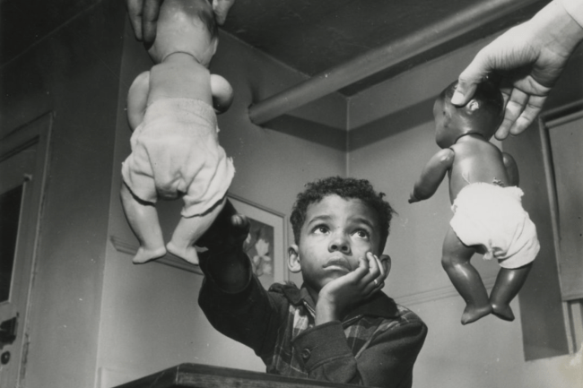 Photo of a boy and the doll test by Gordon Parks