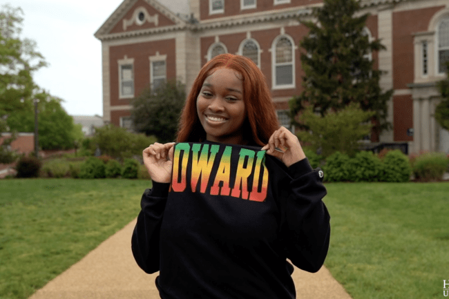 Graduating Howard University senior Chantel Williams outside Founders Library