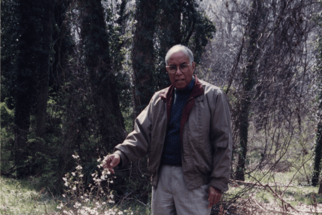 The late Maurice Jefferson posing for his Botany photo by standing next to a tree he likely grew