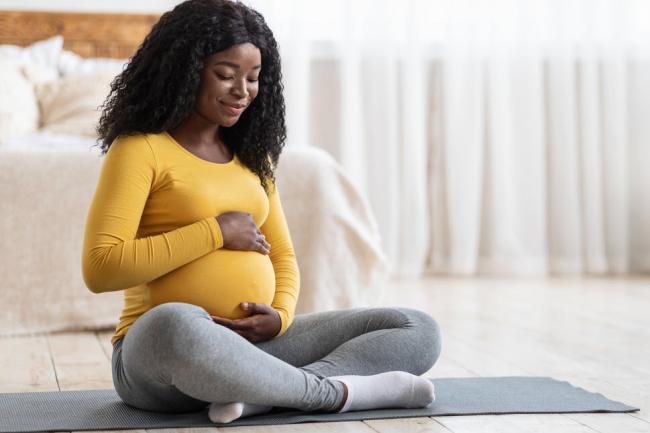 pregnant woman doing yoga-