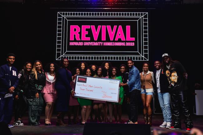 Members of the Alpha Chapter of Alpha Kappa Alpha Sorority, Inc. hold up their $3,000 checks as the sorority winners of the 2023 Homecoming Step Show 