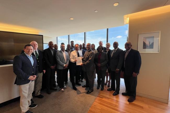 Representatives from UNCF, Adage Capital, Howard University and Morehouse College pose for a photo