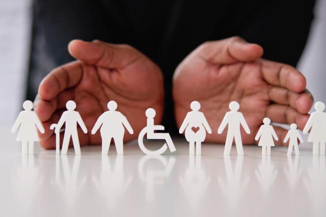 Paper cutouts representing diverse demographics