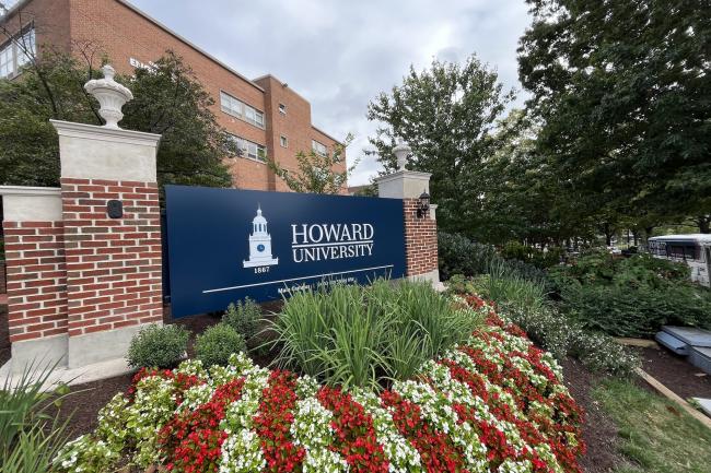 Howard University Sign surrounded by flowers on Georgia Avenue