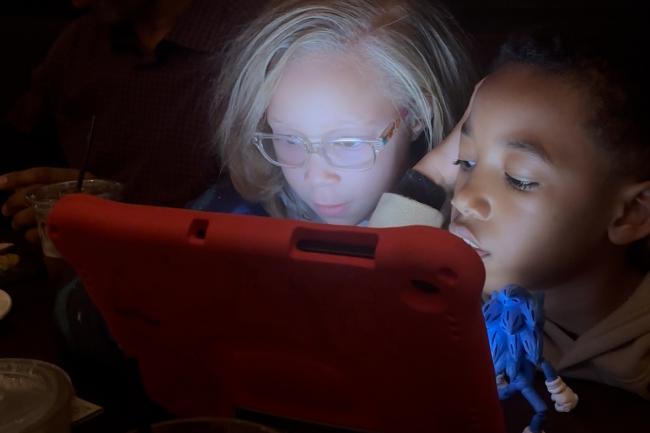 Two Children Using Screens