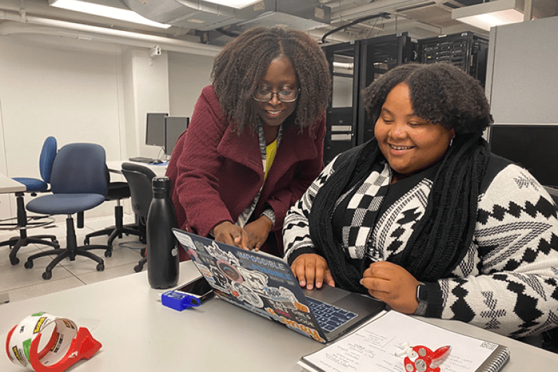 Dr Washington with a graduate student in office