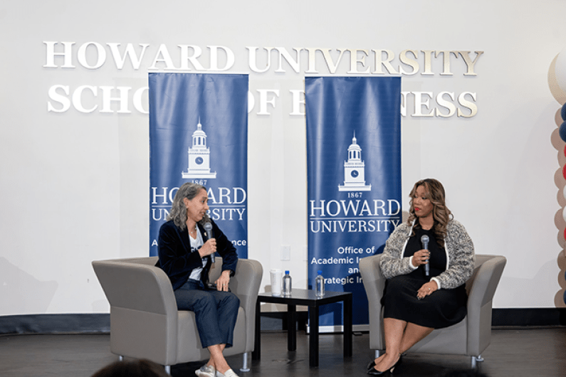 Talitha Washington and Ashley Gatewood speaking on stage