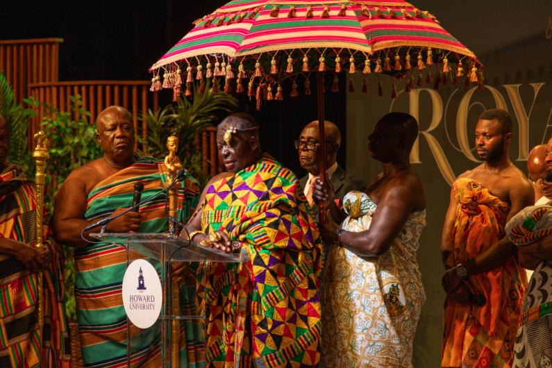 The Asantehene at Howard University's Cramton Auditorium dressed in colorful traditional Ghanian attire