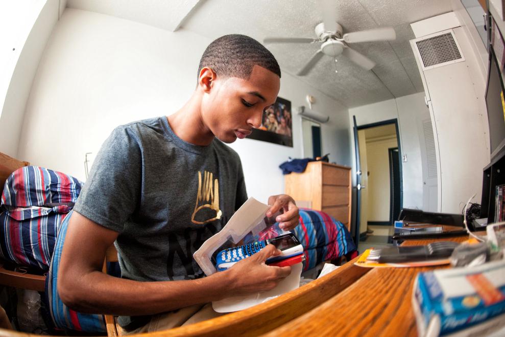 Student Moving Into Dorm Room