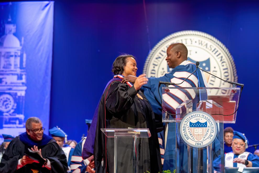 Howard President Dr. Wayne A.I. Frederick adorns School of Law Dean Danielle R. Holley with the Presidential Medal during the 2023 Charter Day Convocation