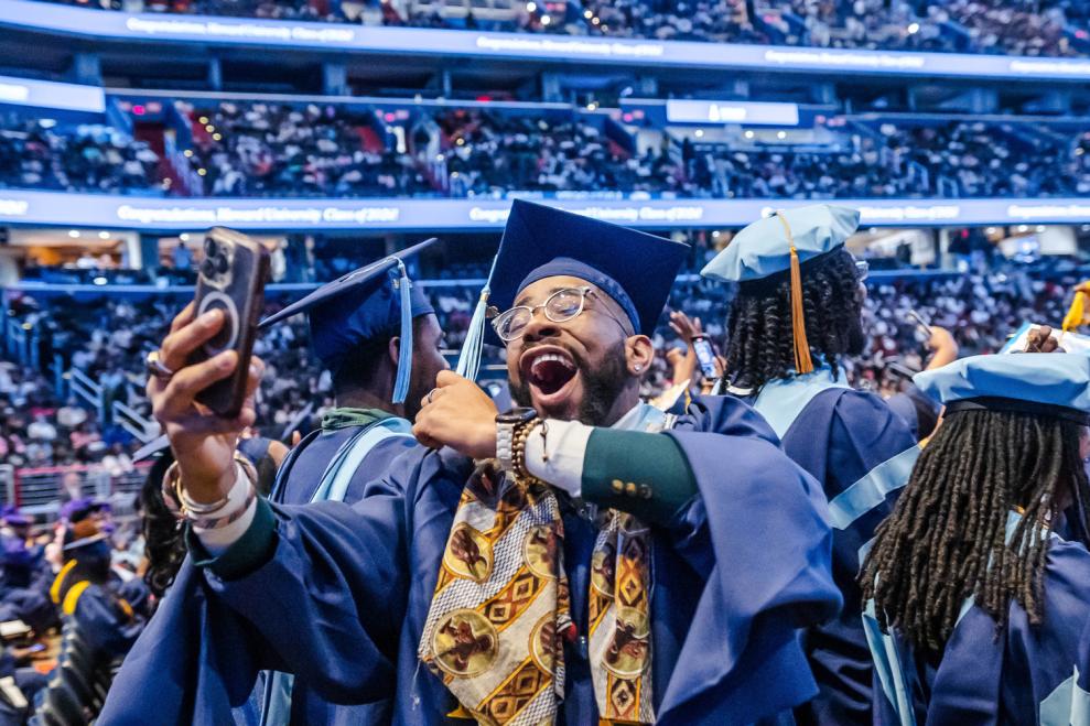 A graduate Facetimes family and friends to celebrate his newly marked status as an alumnus of Howard University.