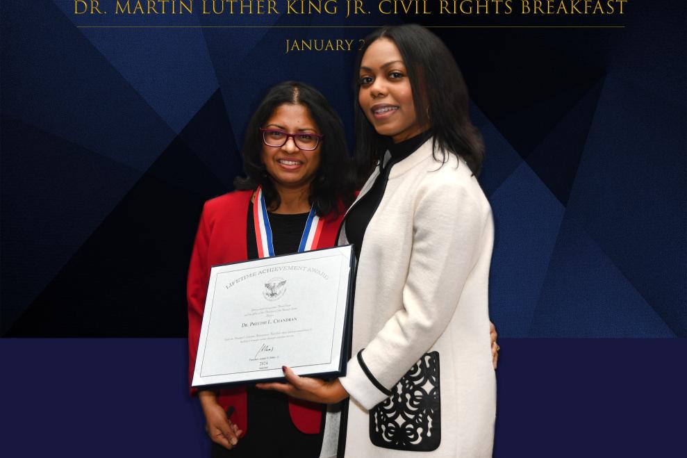 Dr. Chandran receiving award from Heart of Tabitha foundation 
