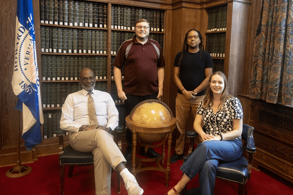 Left to right: Errol Watkis, Nicholas Oakley, Chris Harper, and Katharine Elkes in Founders Sitting Room